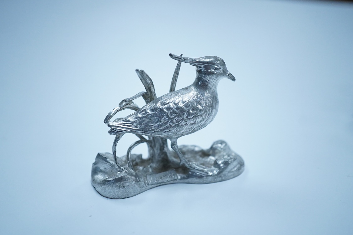 A George VI Art Deco engine turned silver mounted trinket box, by Dudley Russell Howitt, Birmingham, 1947, width 85mm, together with a late Victorian silver fruit knife, a silver thimble, a white metal cockerel mounted s
